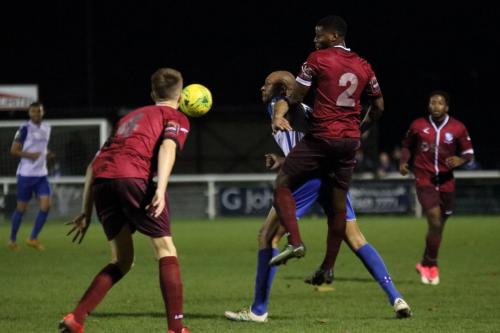 Wingates Jake Eales (4) and Ola Williams and Enfields Simon Thomas