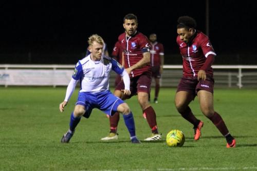 Wingates Luke Ifill (R) and Ahmet Rifat and Enfields Ryan Blackman