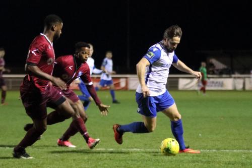 Wingates Ola Williams (L) and Reece Beckles-Richards and Enfields Drew Roberts