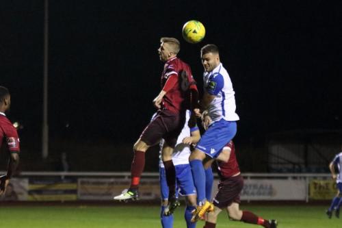 Wingates Rob Laney (maroon) and Enfields Taylor McKenzie