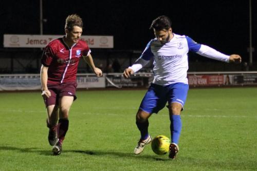 Wingates Sean Cronin (L) and Enfields Mario Noto