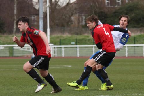 Brightlingseas Jake Turner (4) and Thomas Dunningham and Enfields Sam Youngs
