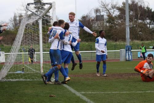 Captain Ryan Blackman jumps into the celebtrations for the second goal
