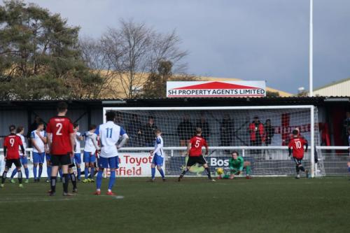 Enfield keeper Joe Wright collects a weakly-struck free kick