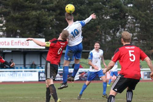 Enfields Brad Wadkins and Brightlingsea Matt Cripps (L) and Josh Gould