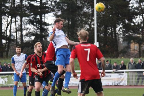 Enfields Matt Johnson heads just over the bar