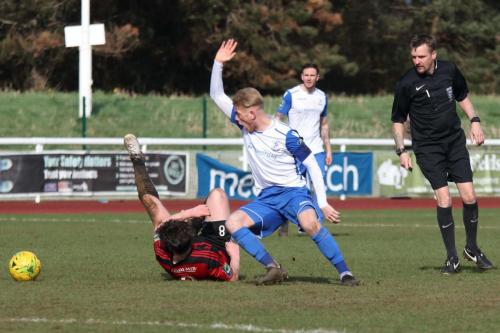 Enfields Ryan Blackman (white) appeals for a handball by Thomas Dunningham  Referee Tim Donnellan disagrees