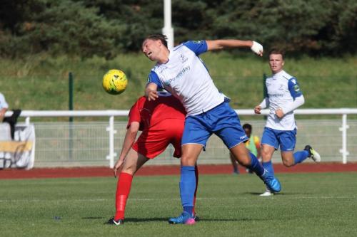Enfields Sam Youngs (white) challenges Adam Richards