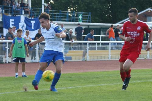 Enfields Sam Youngs crosses past Mark McLeod