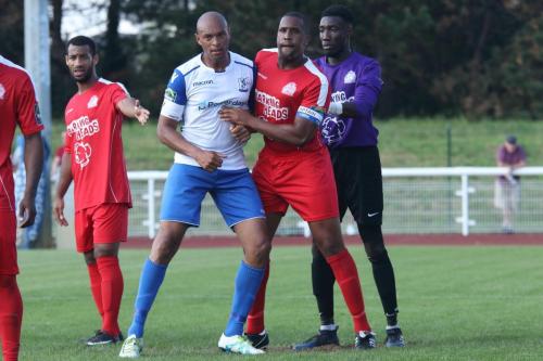 Enfields Simon Thomas (white) and Harrows Curtis Ujajh jostle for position