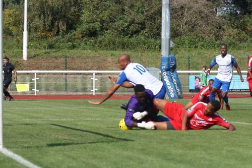 Harrow keeper Melvin Minter fumbles Ryan Blakes (R) shot  The ball runs loose for Simon Thomas (10) to open the scoring
