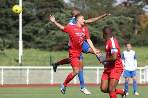 Harrows Adam Richards (red) challenges Simon Thomas