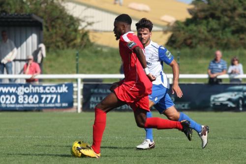 Harrows Kurtis Cumberbatch (red) and Enfields Mario Noto