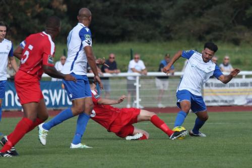Harrows Mark McLeod (red) challenges Mario Noto104