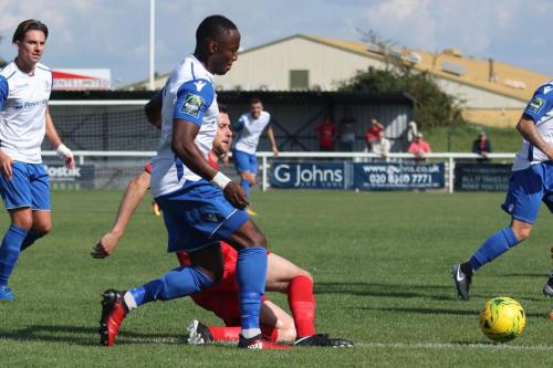 Harrows Mark McLeod (red) tackles Ryan Blake