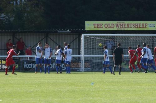 Harrows Michael Bryan (L)) equalises from a free kick