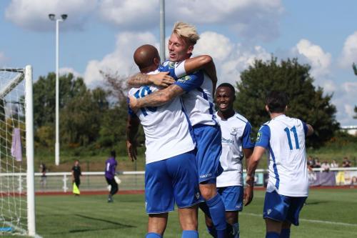 Ryan Blackman congratulates Enfield scorer Simon Thomas (10)