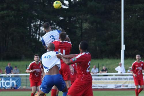 The ball clears Enfields Taylor McKenzie (3) on its way to Simon Thomas who scores the winning goal