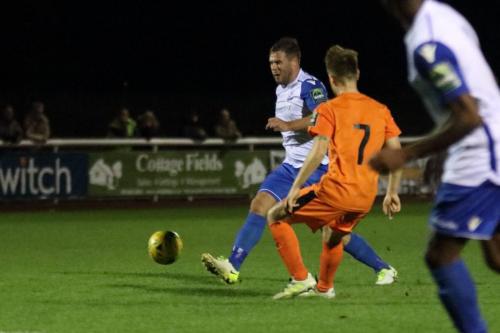 Enfields Adam Martin (L) and Leistons Byron Lawrence