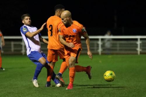 Enfields John Kyriacou and Leistons Seb Dunbar (3) and Matt Blake