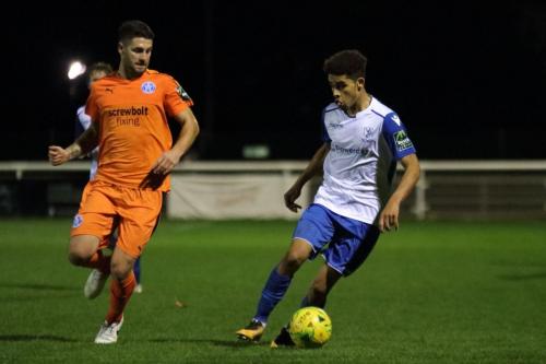 Enfields Montell Moore (R) and Leistons Dominic Doherty