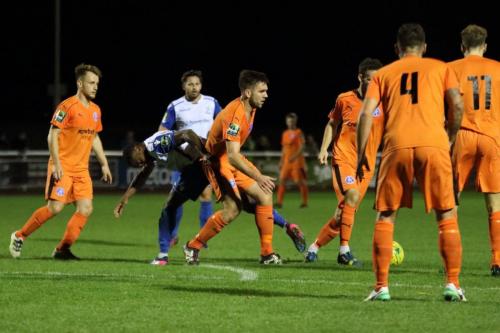 Enfields Ryan Blake is crowded out by the defence