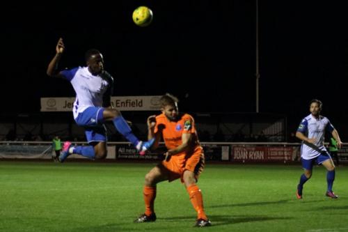 Enfields Ryan Blake lifts the ball over Joe Jefford