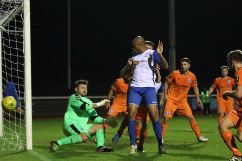 Enfields Simon Thomas (white) deflects a shot just wide