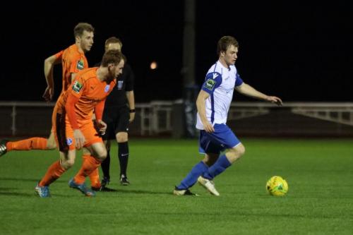 Leistons Dominic Doherty (L) and Patrick Brothers chase Aaron Greene