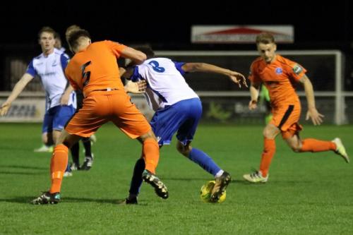 Leistons Joe Jefford (5) tries to hold back Montell Moore