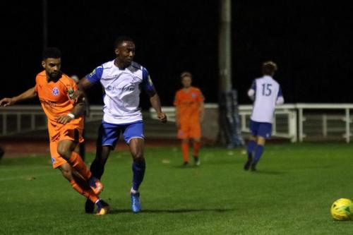 Leistons Seb Dunbar (L) and Enfields Ryan Blake