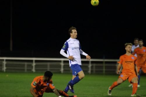 Leistons Seb Dunbar (L) tackles Mickey Parcell