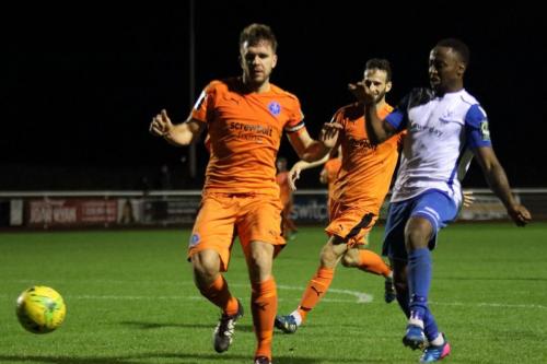 Leistons Tom Bullard (L) and Joe Marsden and Enfields Ryan Blake