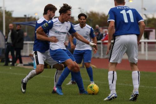 Enfields Sam Youngs (2nd L) takes the ball to the corner in the closing minutes