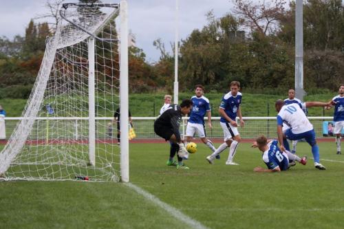 Enfields Simon Thomas (10) watches his shot deflected for a corner