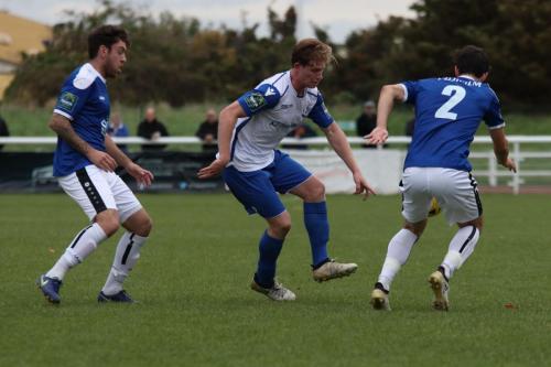 Margates Jack Evans (L) and Tom Mills and Enfields Aaron Greene