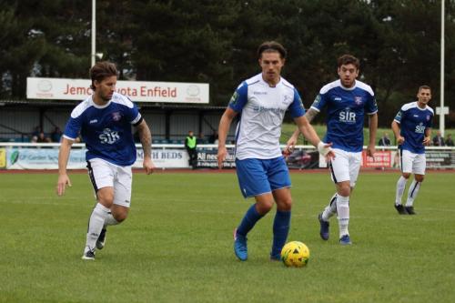 Margates James Rogers (L) and Jack Evans and Enfields Sam Youngs