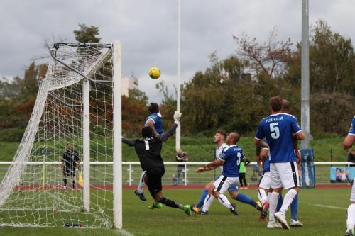With his keeper beaten, Margates Jack Evans heads off the line