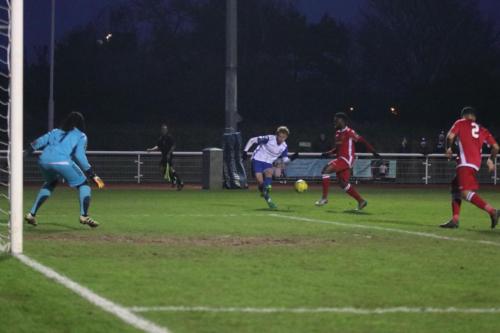 Enfields Aaron Greene tries to curl in a shot