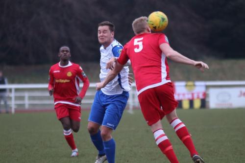 Enfields Liam Hope and Mersthams Liam Harwood (5) and Kershaney Samuels