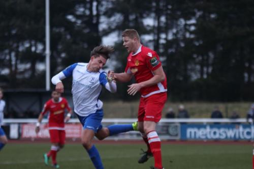 Enfields Sam Youngs (L) and Mersthams Liam Harwood