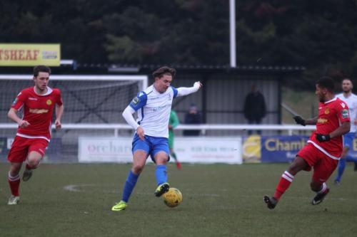 Enfields Sam Youngs and Mersthams Ben Harrison (L) and Reece Hall