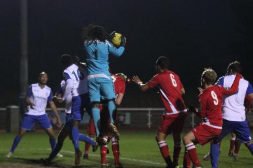 Merstham keeper Ashlee Jones collects a cross