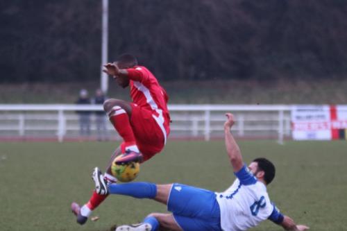 Mersthams Alex Addai (red) and Enfields Mario Noto