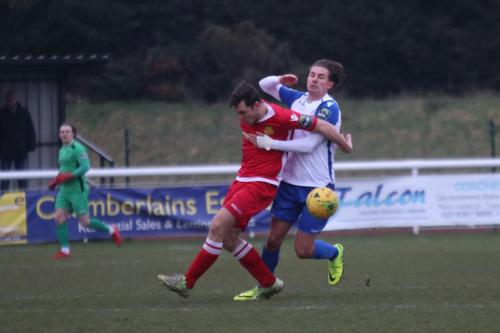 Mersthams Ben Harrison (red) and Enfields Sam Youngs