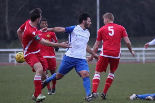 Mersthams Liam Harwood (5) clears from Mario Noto