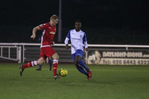 Mersthams Liam Harwood (L) and Enfields Ryan Blake