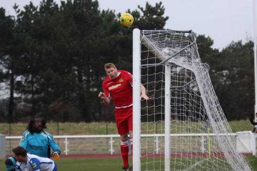 Mersthams Liam Harwood heads clear from under the crossbar