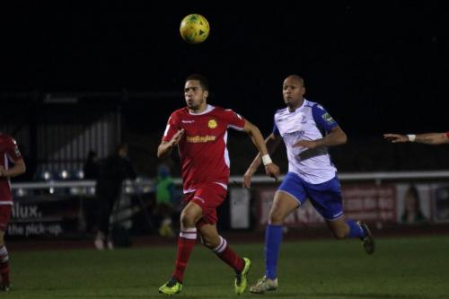 Mersthams Tutu Henriques (L) and Enfields Simon Thomas