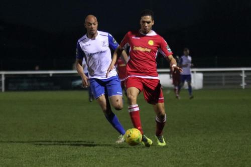 Mersthams Tutu Henriques (R) and Enfields Simon Thomas